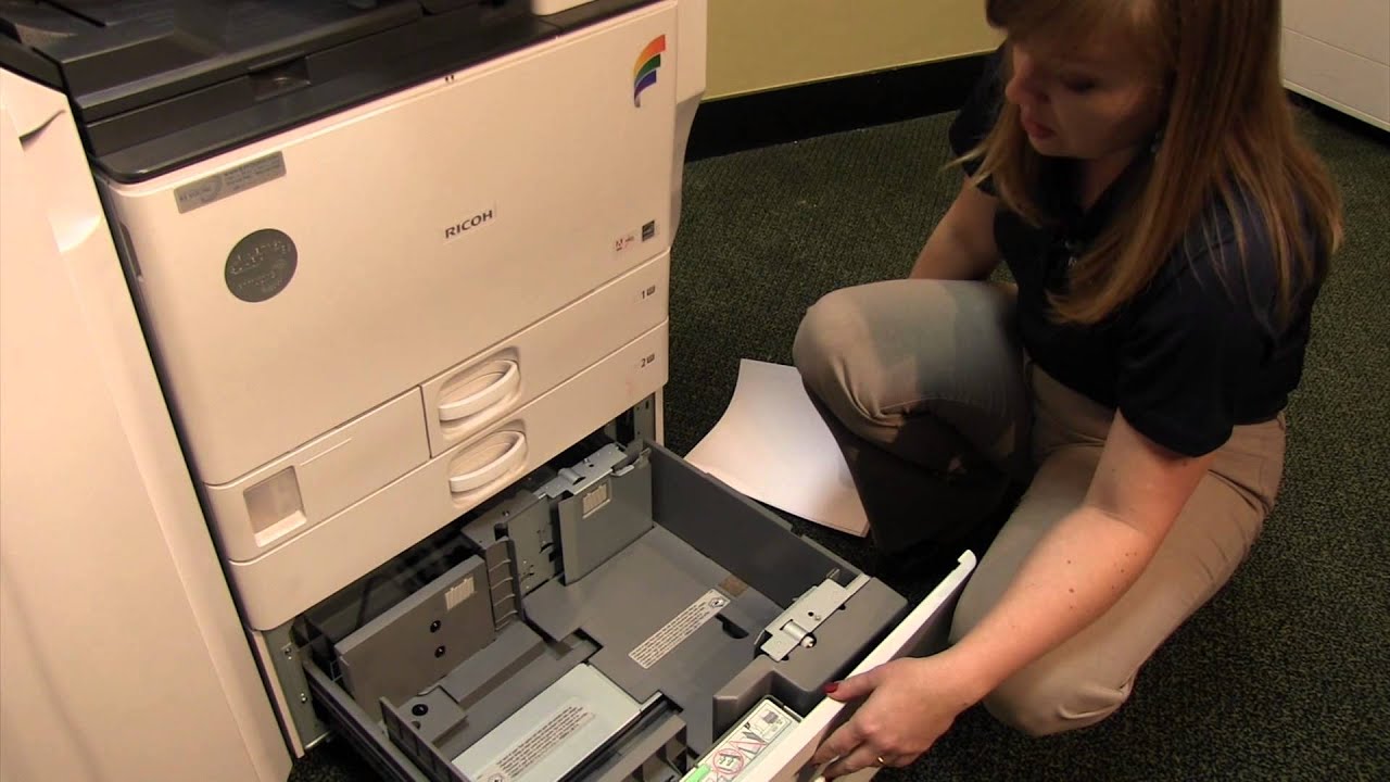 Bạn cần phải mở khay chứa giấy của máy photocopy ra